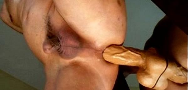  Man masturbating with 8 inchs dildo.